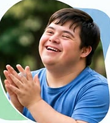 Young man laughing and clapping his hands